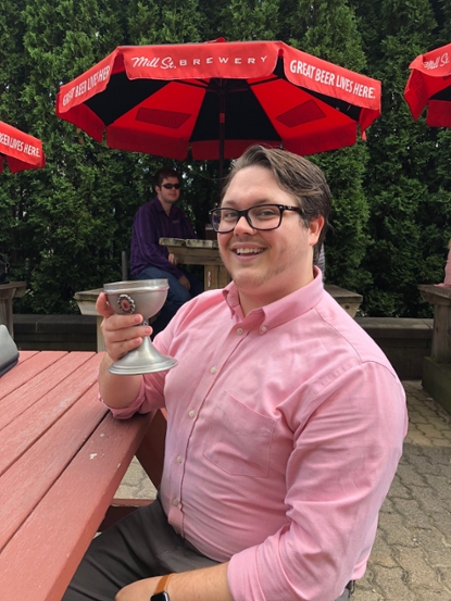 Joe Nidel celebrates a successful Masters thesis defense
